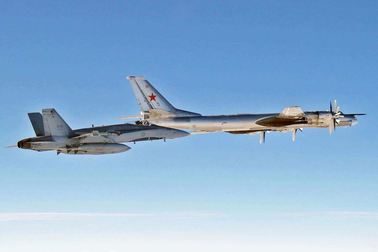 Tu-95 bomber escorted by a Royal Canadian Air Force CF-18 fighter (Robert Sullivan)