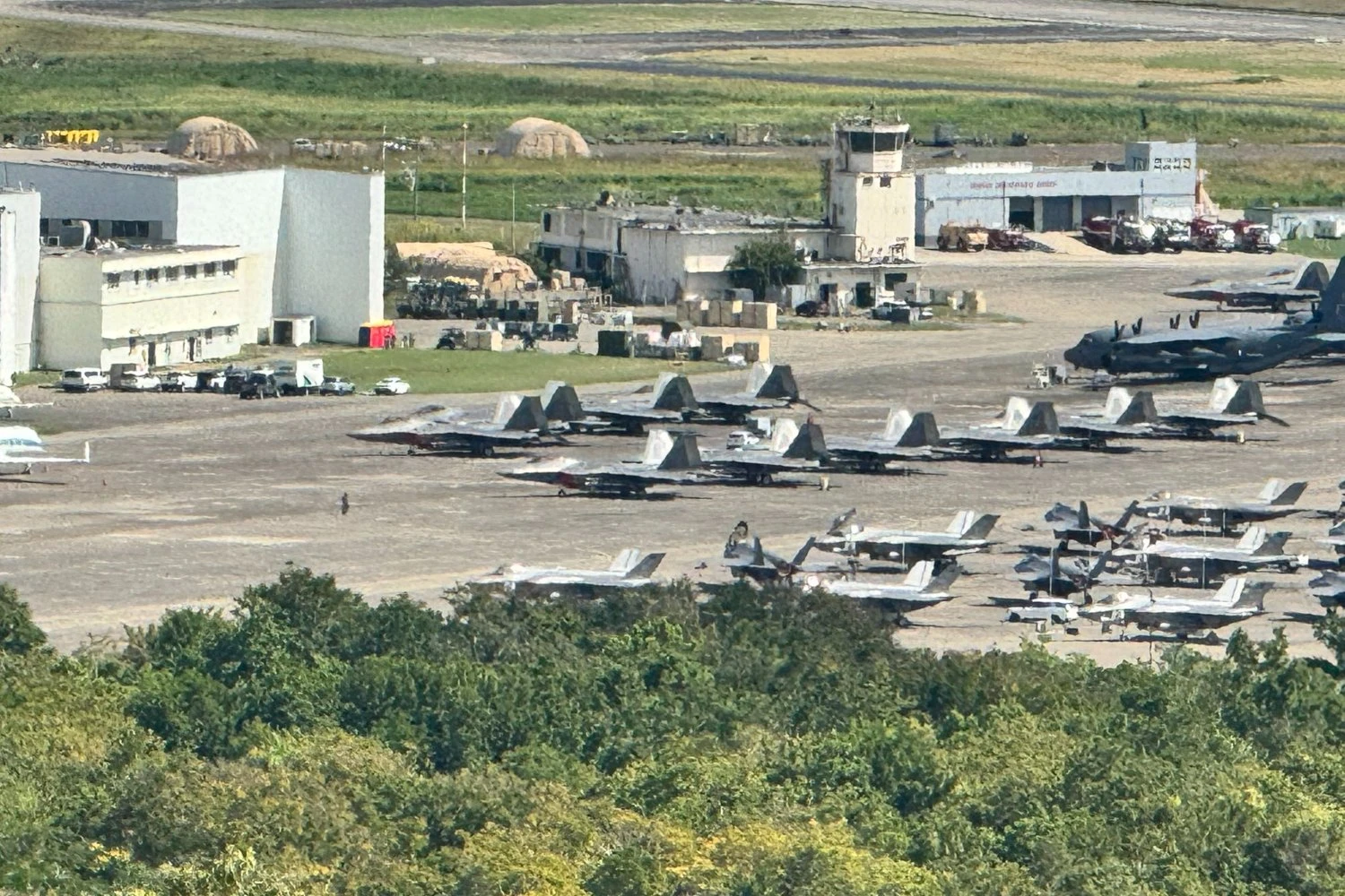 Several F-22 fighter jets in the Caribbean alongside F-35s, C-130s, and other aircraft (Social media)