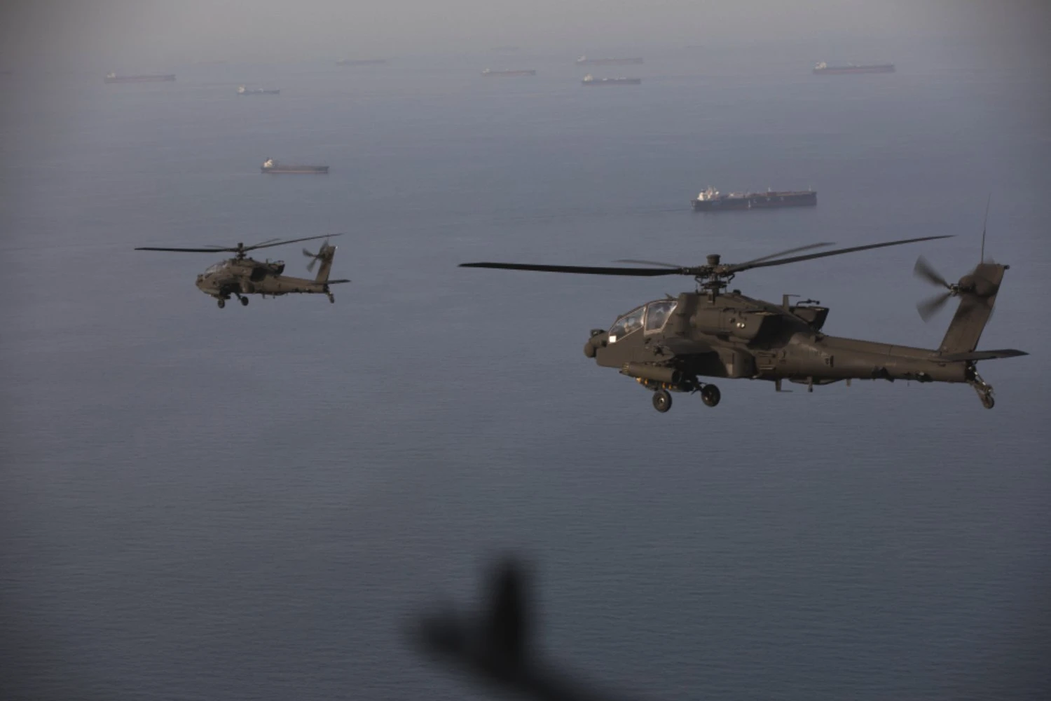 US Army Apaches fly armed patrols over Strait of Hormuz as tensions persist