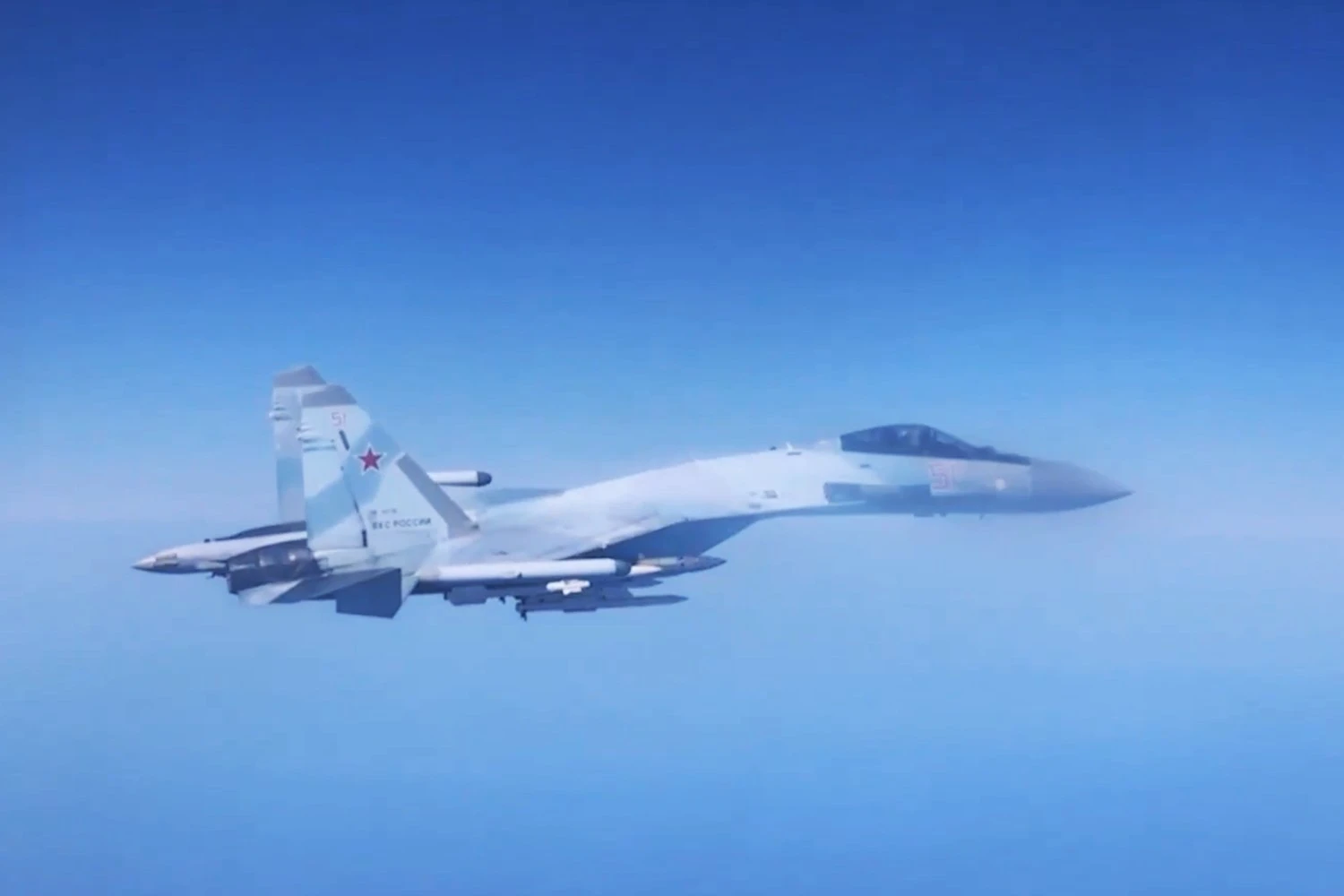 Russian Su-35 fighter jet flies alongside RC-135W