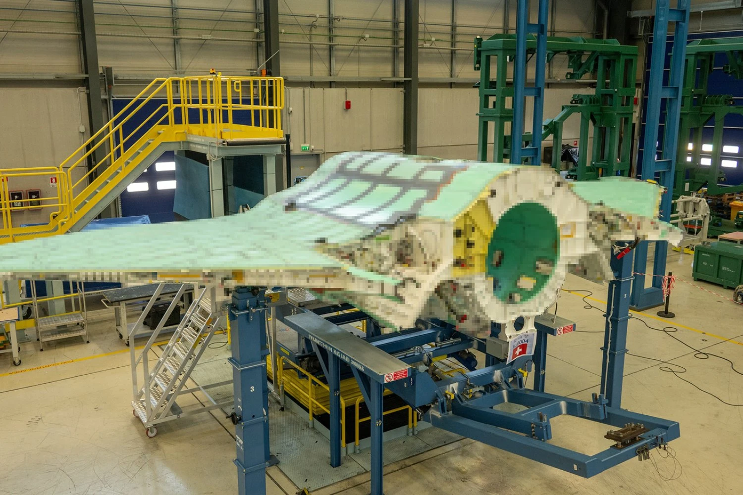 Fuselage and wing structure of the Swiss F-35, produced in Italy. Image intentionally pixelated
