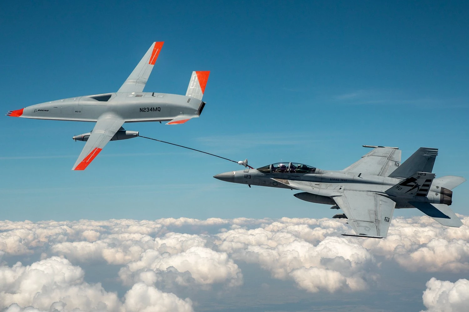 An MQ-25 prototype refuels a U.S. Navy F/A-18F fighter jet | US NAVY