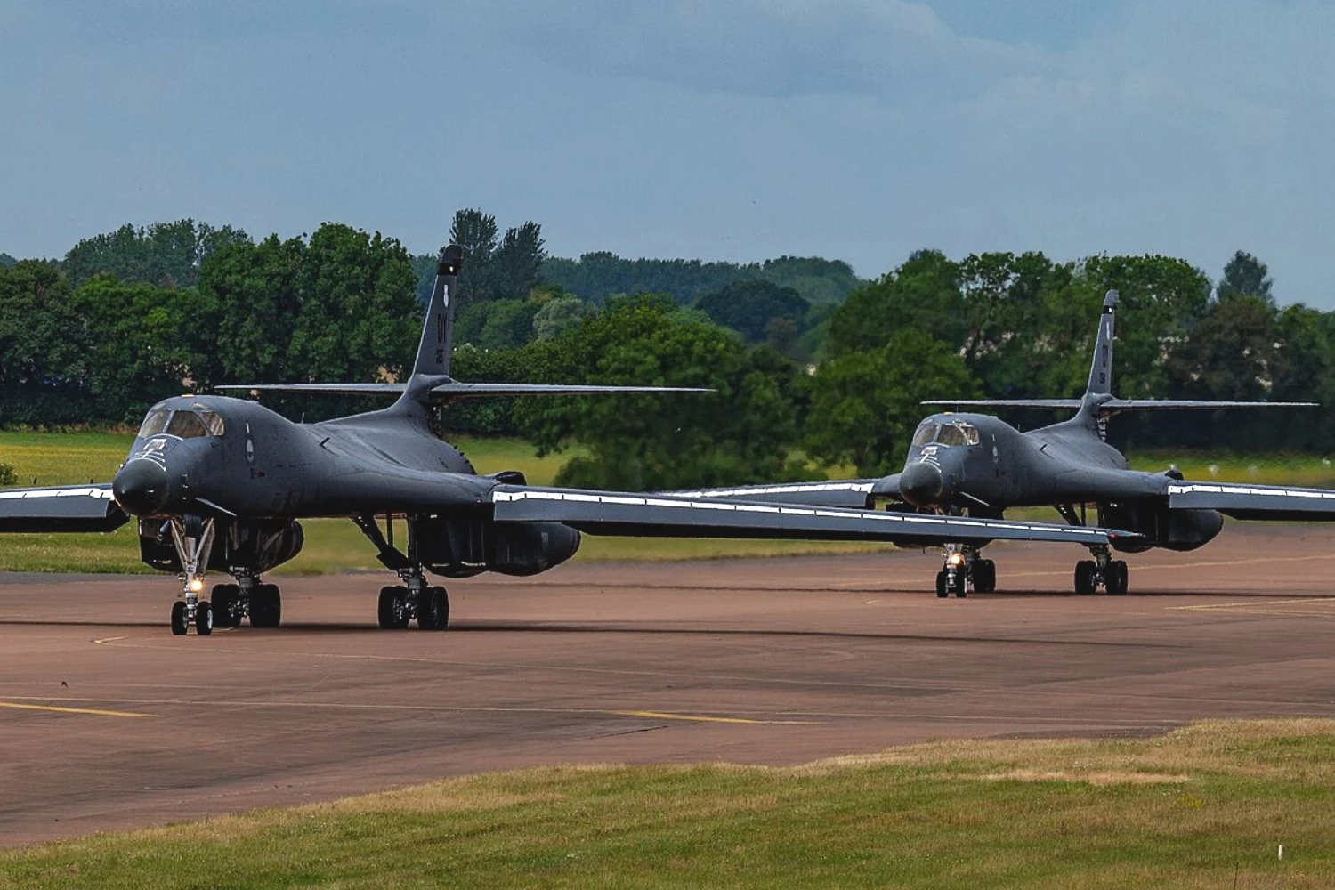 Two B-1B Lancers taxi the runway before takeoff at RAF Fairford | USAF
