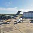 The C-390 Millennium alongside the A-29 and the Phenom 300E and Praetor 600 business jets in Melbourne, Florida